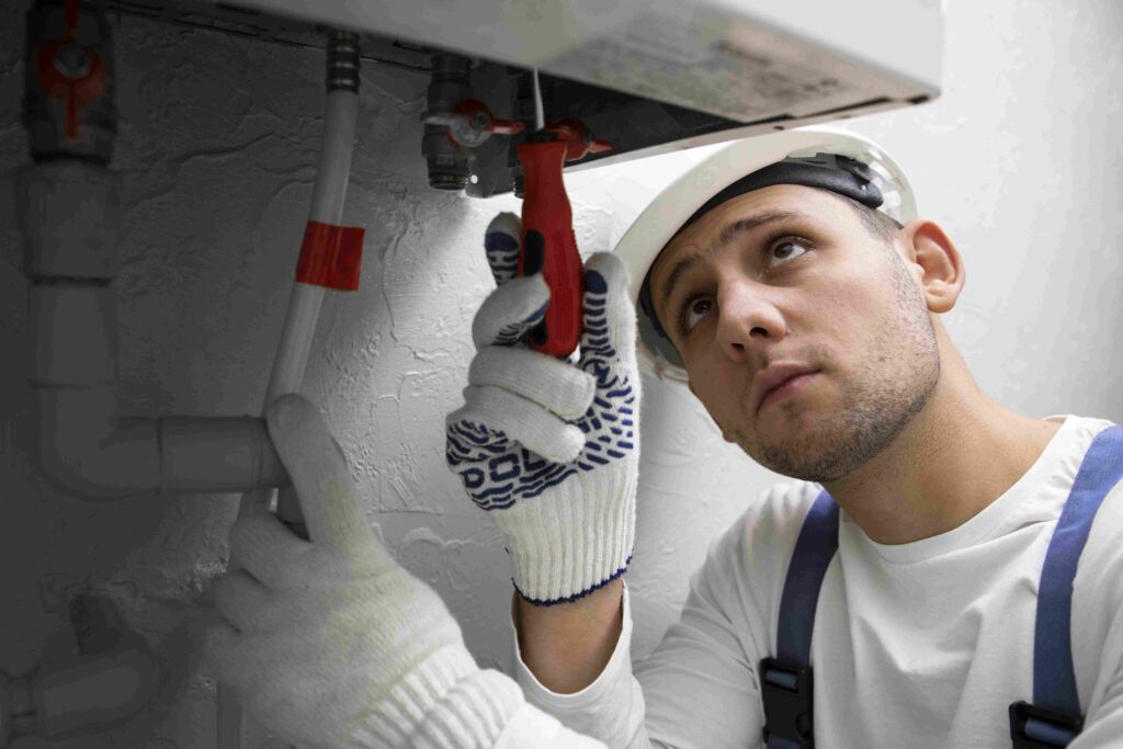 worker-repairing-water-heater-boiler-replacement
